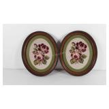 Two oval wall hanging needle points, framed and