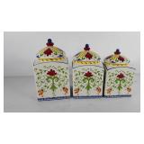 Three ceramic canisters, 6"-7"