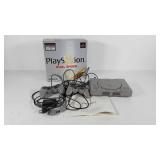 Sony Playstation console and two controllers