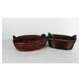 Two decorative baskets with wooden handles