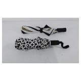 Two collapsible umbrellas