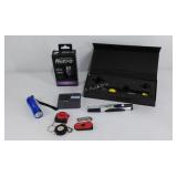 Group of small tools, drill, flashlights, tape