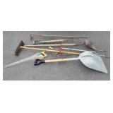 Group of long handle Tools, saw, scoop, hoe,