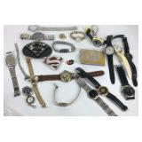 Belt buckles and wrist watches in tin container