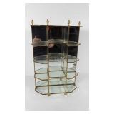 Mirrored glass and brass trinket shelf, has crack