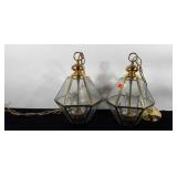 Pair of brass light fixtures with beveled glass