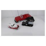 Group of three toy cars, remote control, bank,