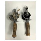 Two casting fishing reels with pistol grip cork
