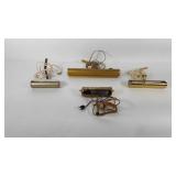 Four wall mounted bankers style lamps