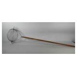 Rolling fruit and nut picker with wooden handle,