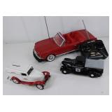 Group of three toy cars, remote control, bank,