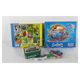 Two puzzles, one shaped puzzle, and toy train in