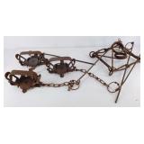 Iron animal traps made by Victor Animal Trap Co,