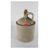 Stoneware whiskey jug with cork, has some