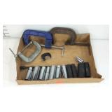 Four adjustable clamps and some sockets