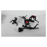 Four wall hanging gymnast sculptures