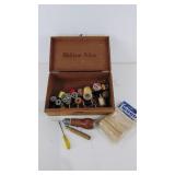 Wooden cigar box with spools of thread,