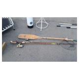 Fishing poles, net and wooden boat paddles