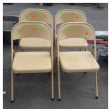 Four metal folding chairs