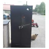 Metal storage cabinet six feet tall, does have
