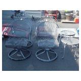 Four swivel wrought iron patio chairs and two end