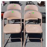 Four metal folding chairs