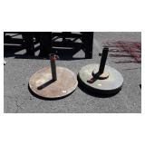 Two patio umbrella stands
