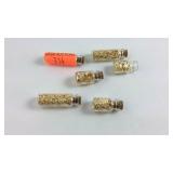 Six mini jars with gold flakes total weight with