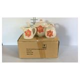 Three piece tea set with teapot, sugar, and