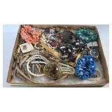 Flat of costume jewelry