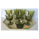 7 green pedestal glasses and a candy dish