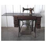 Singer treadle base Sewing machine in oak Cabinet