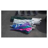 Two canopy frames with umbrellas