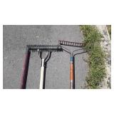 Group of four rakes, 2 garden, one leaf, and one