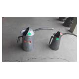 Two oil cans
