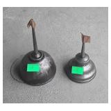 Two small oil cans