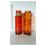 Two large colorful glass vases.
