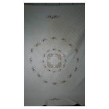 Quilted bed spread with embroidered details