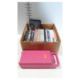 DVD movies, VHS tapes, and case of cassettes
