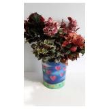 Large tin full of artificial floral and evergreen