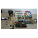 Games and puzzles, includes Taboo, SongBurst, tin