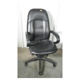 Executive style adjustable chair. Shows some wear.