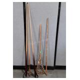 3 Pool cues, lacross stick, etc