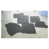 Assorted car floormats.