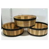 Three half bushel style short baskets.