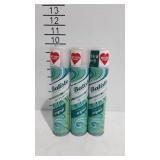 Three cans of Batiste dry shampoo