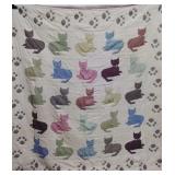 Old quilt with 25 blocks of a resting cat, border