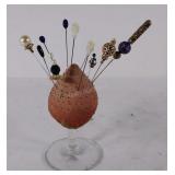 Pin holder with pins.