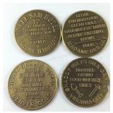 Four brass brothel tokens