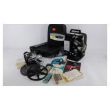 Bell and Howell 8mm camera, projector with cases,